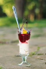 Berries with whipped cream in a beautiful cup.