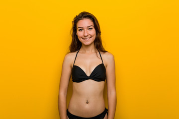 Young european woman wearing bikini happy, smiling and cheerful.