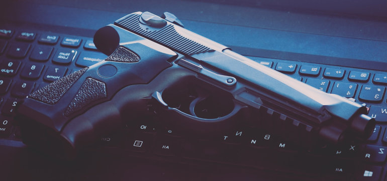 Black air gun on the keyboard.