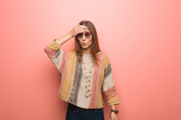 Young hippie woman on pink background worried and overwhelmed
