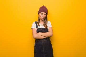 Young hipster woman crossing arms relaxed
