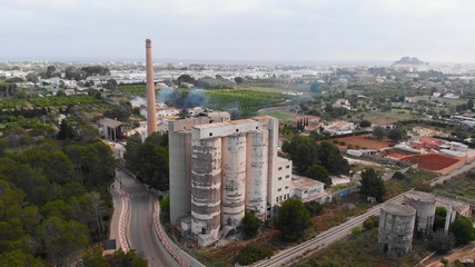 Fototapeta premium Aerial view of an old and ruined cement factory.