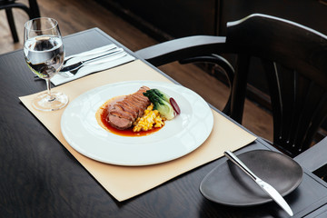 Roasted Duck Breast with cream of corn and tamarind poultry jus, Served with bread and butter.