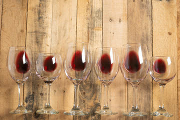 Flat lay red wine in glasses on wooden background with space, Concept of wine distillation, winery,...