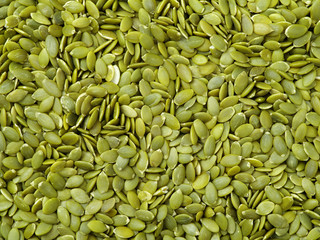 Macro background texture of green pumpkin seeds