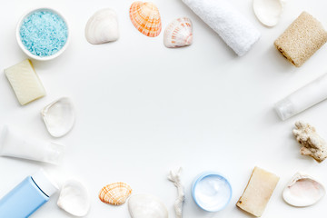 cosmetics frame with Dead Sea minerals and shells on white background top view copy space