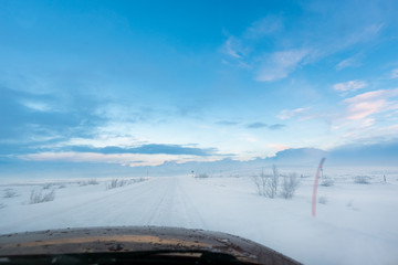 Driving Eastward on a snow road from the Russian city of Murmansk, North of the Polar Circle