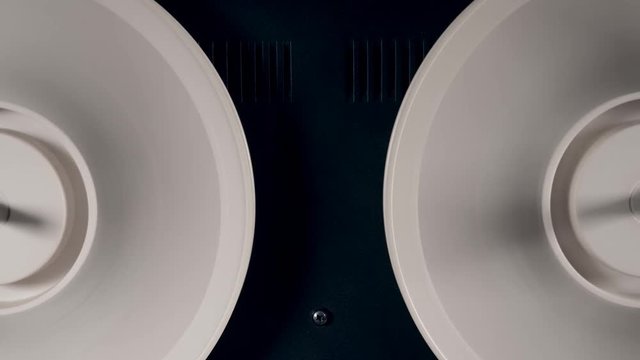 Spools with tape spinning fast on a magnetic player.
