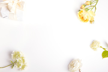 Festive flower composition on the white background. Overhead view