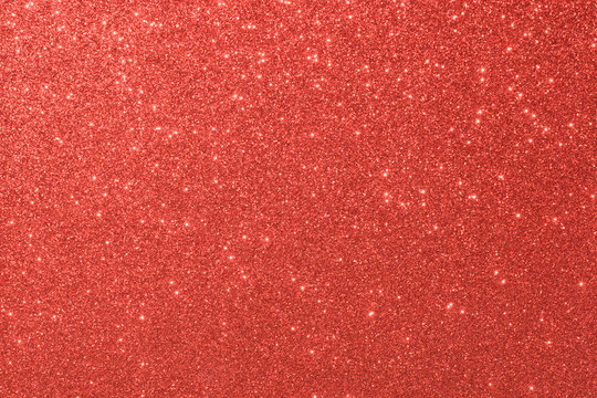 red glitter macro background. Close-up shot of glittery texture.