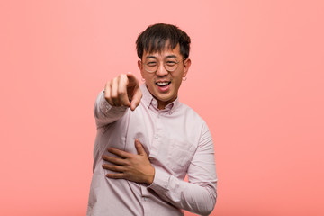 Young chinese man dreams of achieving goals and purposes