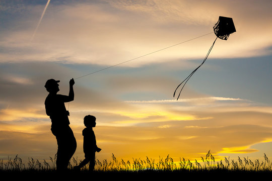 father and son with kite
