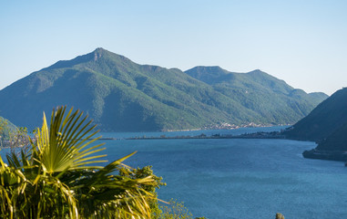 lake in mountains. Mt. San Giorgio and Melide.
