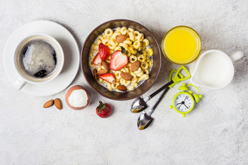Balanced traditional breakfast concept. Whole grain rings, coffee, orange juice and egg