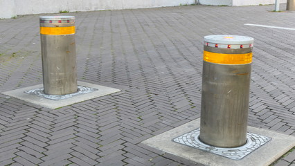 Two steel bollards within the pedestrian zone in the City of the Hague, to protect civilians against cars and terrorism