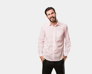Fototapeta premium Young handsome man winking, funny, friendly and carefree gesture