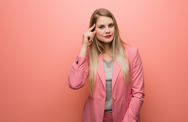 Young russian woman wearing pajama thinking about an idea