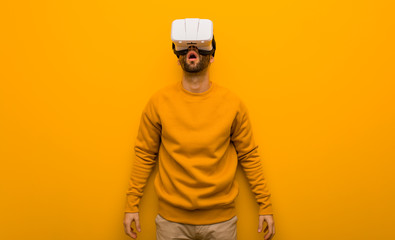 Young man wearing a virtual reality glasses