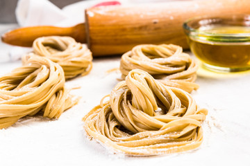 Italian raw uncooked tagliatelle pasta