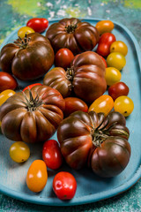 Colorful tomato variety on wooden board