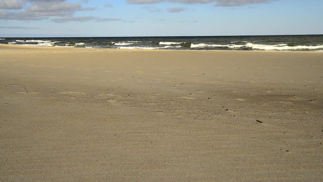 Beach of the Baltic Sea in Poland with surf