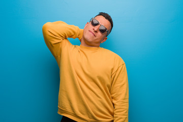 Young colombian man suffering neck pain