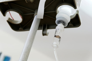 Bottle with a medicinal solution during the treatment procedure, the system. The concept of medicine.