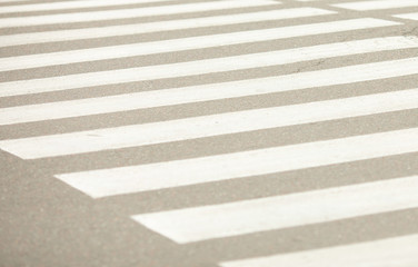 Fototapeta premium Grunge cross walk was on the asphalt road with white stripe lines symbol transportation between concrete pedestrian