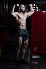 Fototapeta na wymiar Bodybuilder Performing Rear Double Biceps Pose