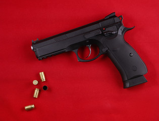 Gun and sleeves on a red background