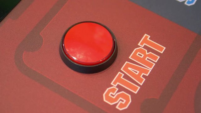 Pressing a start button in 4k slow motion 60fps