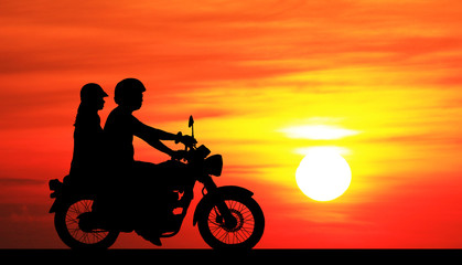 Naklejka na ściany i meble silhouette of lover couple in sunset with classic motorcycle