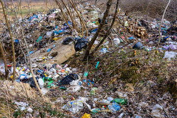 Illegal garbage in spring forest, ecological catastrophe on a large scale in underdeveloped countries.