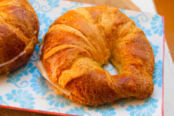 Croissant with cheese fresh breakfast. French bakery in macro.