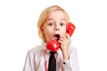 Business Kind staunt mit Telefonhörer