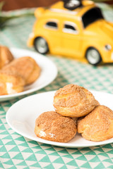 There are delicious puffs and milk on the table