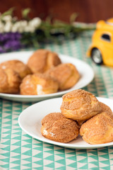 There are delicious puffs and milk on the table