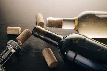 bottles of wine and corkscrew