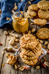 Traditional american baking, homemade Peanut Butter Cookies with peanuts and peanut butter on...
