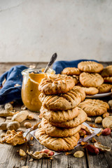 Traditional american baking, homemade Peanut Butter Cookies with peanuts and peanut butter on rustic wooden table