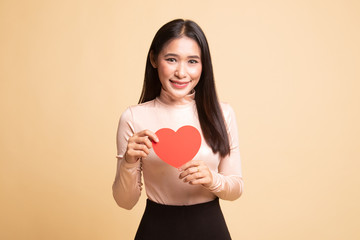 Asian woman with red heart.