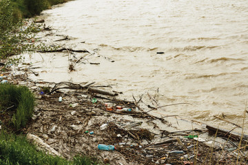 Plastic waste in the river, pollution and the environment in the water, an environmental problem.