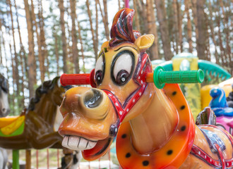 Merry-go-round horses. Vintage merry-go-round wooden cheerful horse