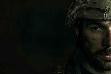 Dark side of me will be closed always. Close up portrait of young male soldier. Man in military...