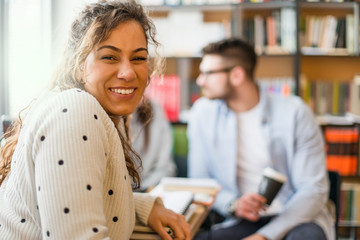 Smiling female woman in library