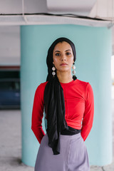 Portrait of a lovely, young and elegant Muslim Malay Asian woman in a hijab tudung headscarf and a...