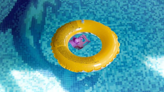 4k footage of yellow inflatable swimming ring at indoor pool