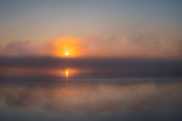 Fototapeta na wymiar Sunrise on the Northern Dvina. morning mist over the river