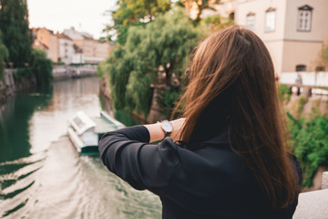 Fototapeta na wymiar Young woman in a Hipster City Lifestyle with Watch on her hand