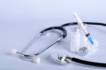  Ampoule with medicines and a syringe , phonendoscope